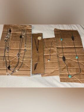 Necklaces lot 4. 1 turquoise color, 1 3 strand leaves, 1, silver, 1 Faux pearl